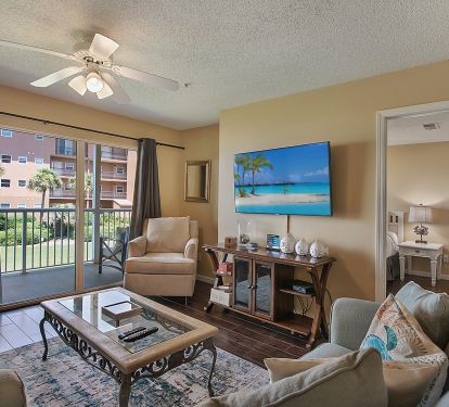 Large TV and walk put to private balcony with Gulf Views