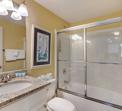 Full bath in hall way. Tub and shower